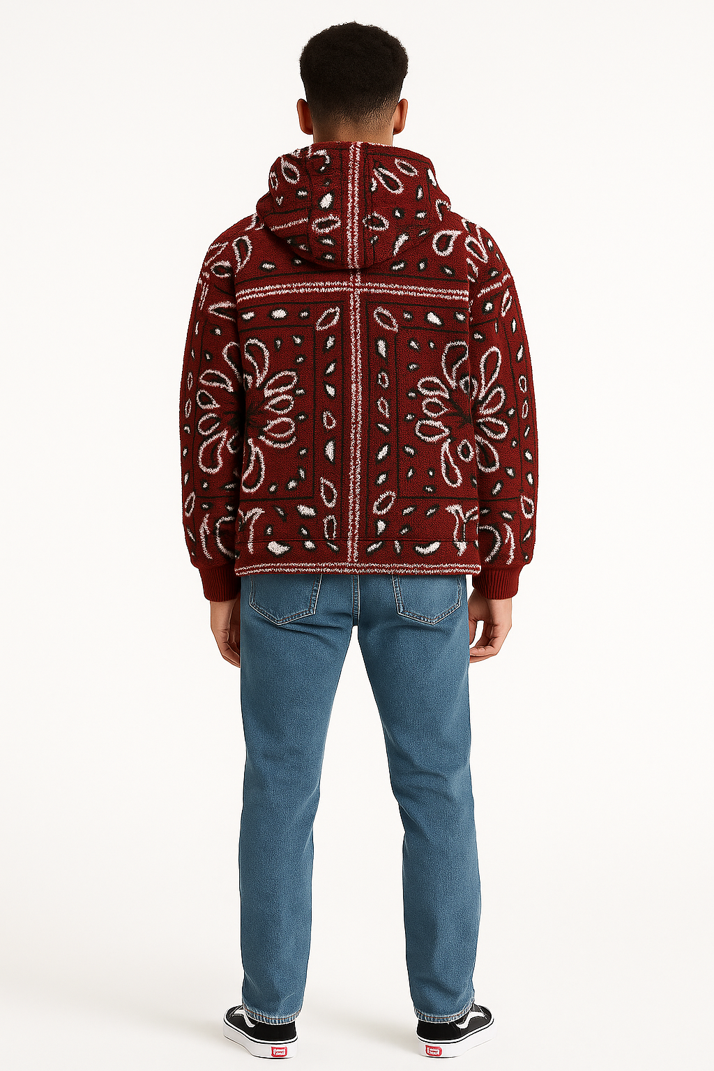 Person wearing a red bandana-patterned jacket on a white background