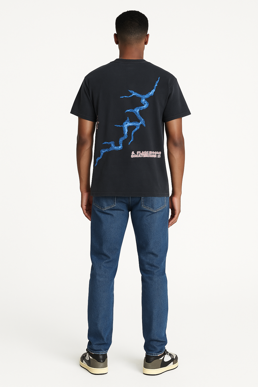 Person wearing a black t-shirt with blue graphic design on the back, standing against a white background