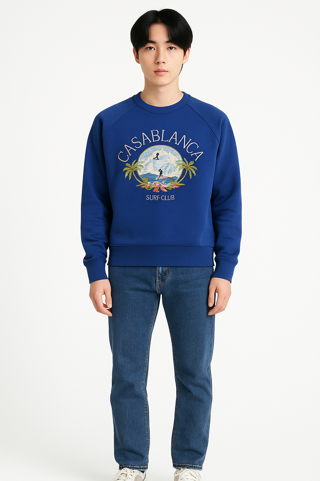 Person wearing a blue sweatshirt with 'Casablanca Surf Club' design on a white background