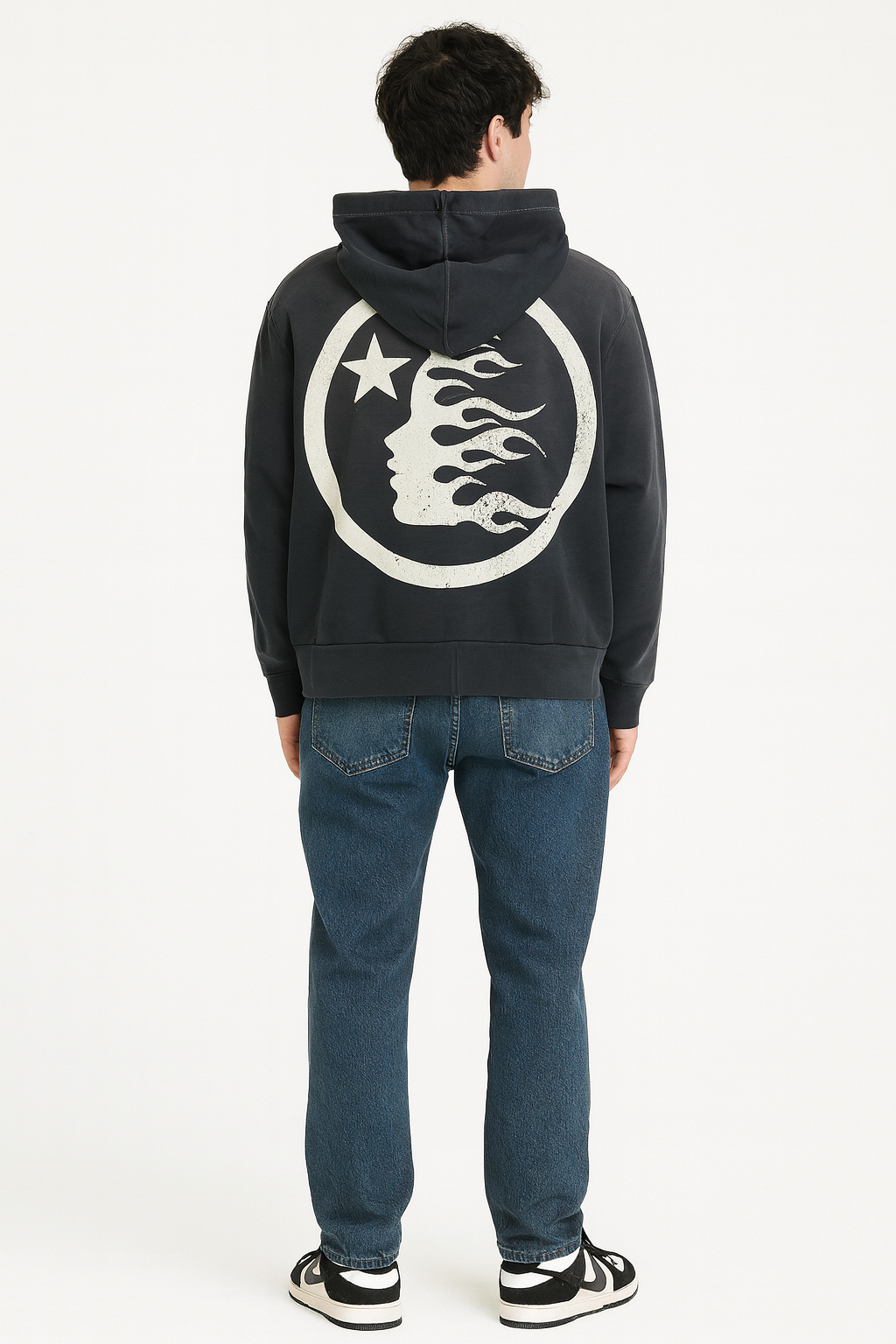 Person wearing a black hoodie with a white logo on the back, standing against a white background