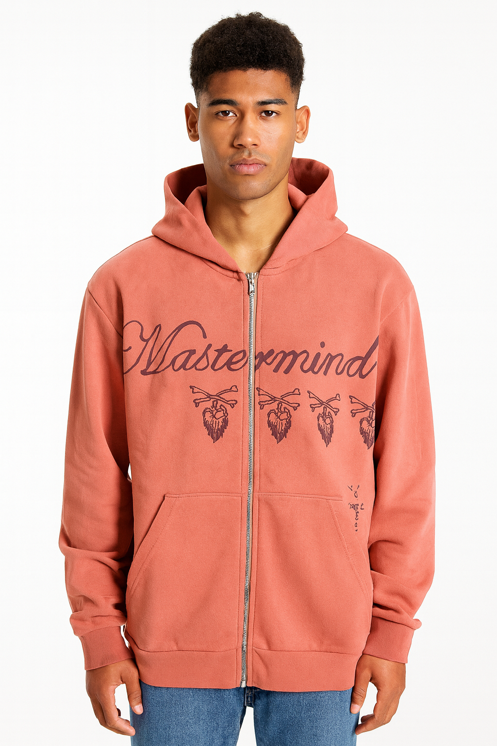 Person wearing a pink hoodie with 'Mastermind' text and graphics on a white background