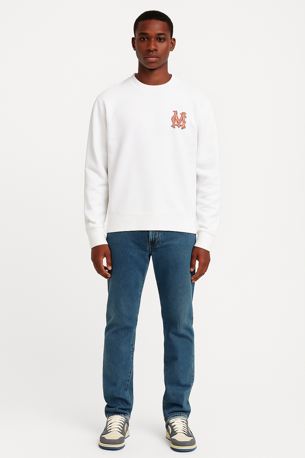 Person wearing a white sweatshirt with a logo and blue jeans on a white background