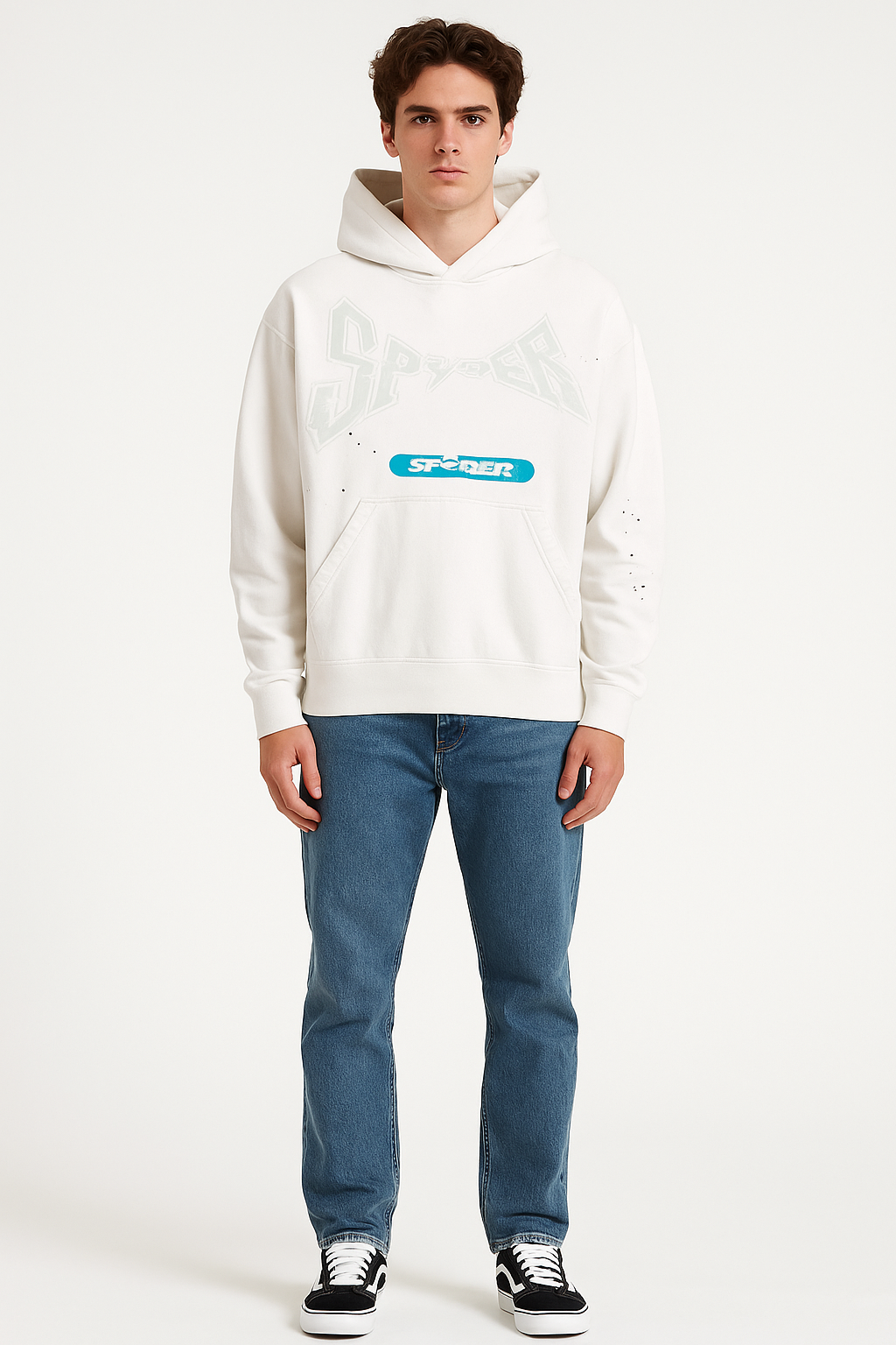 Person wearing a white hoodie with a logo and blue jeans on a white background